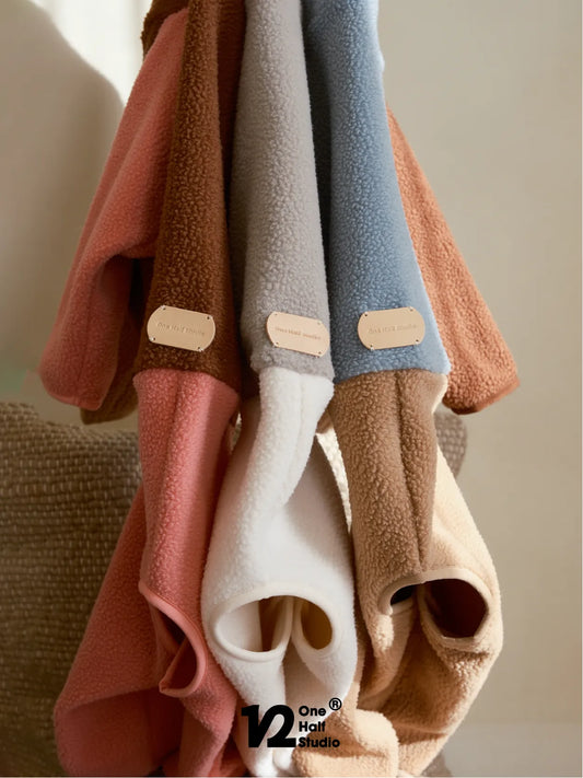 Rack of fleece colorblock four-leg coats in five colourways