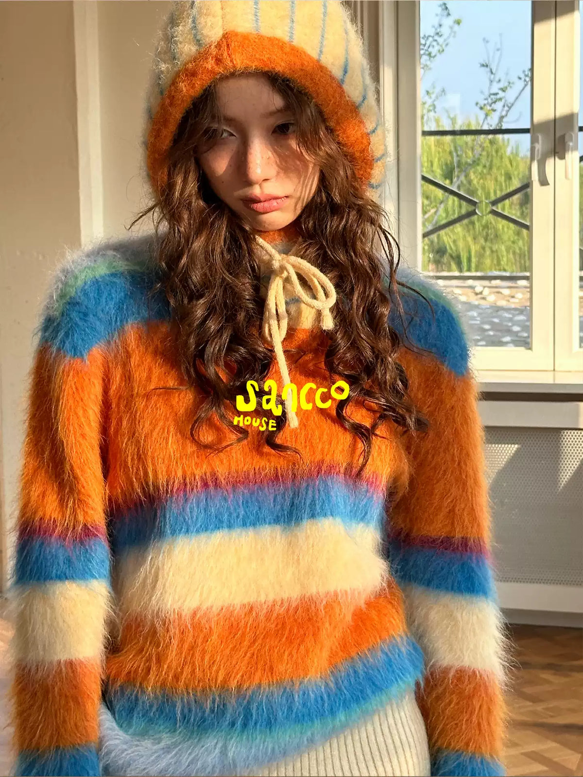 Close-up of the striped knit sweater