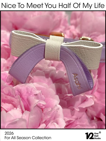 Close-up of the lavender goatskin bow