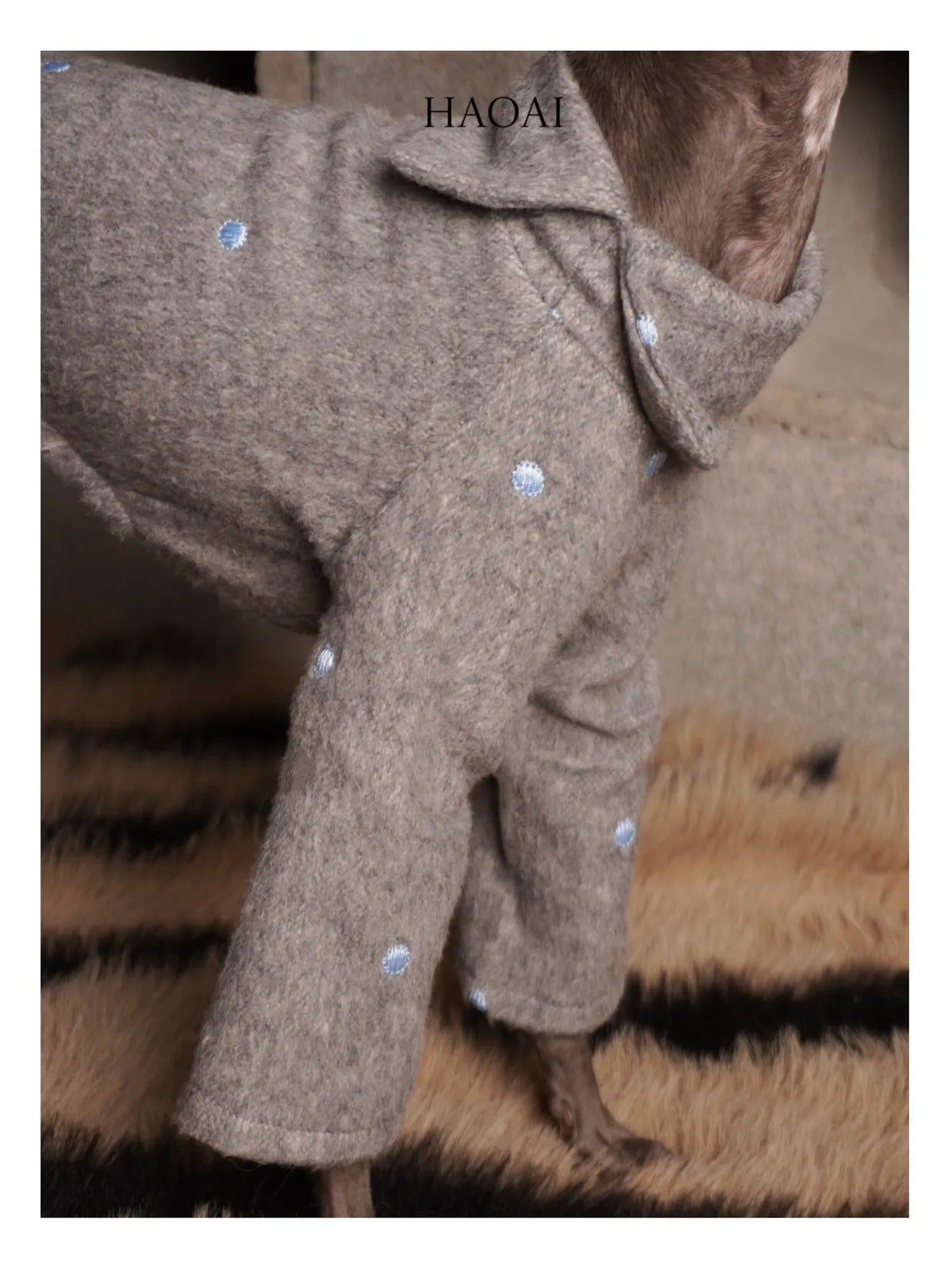 Close-up of the embroidered polka dots on the wool coat