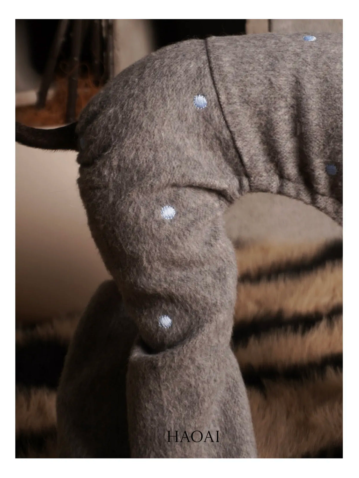 Back view of the four-leg coat showing the button placket