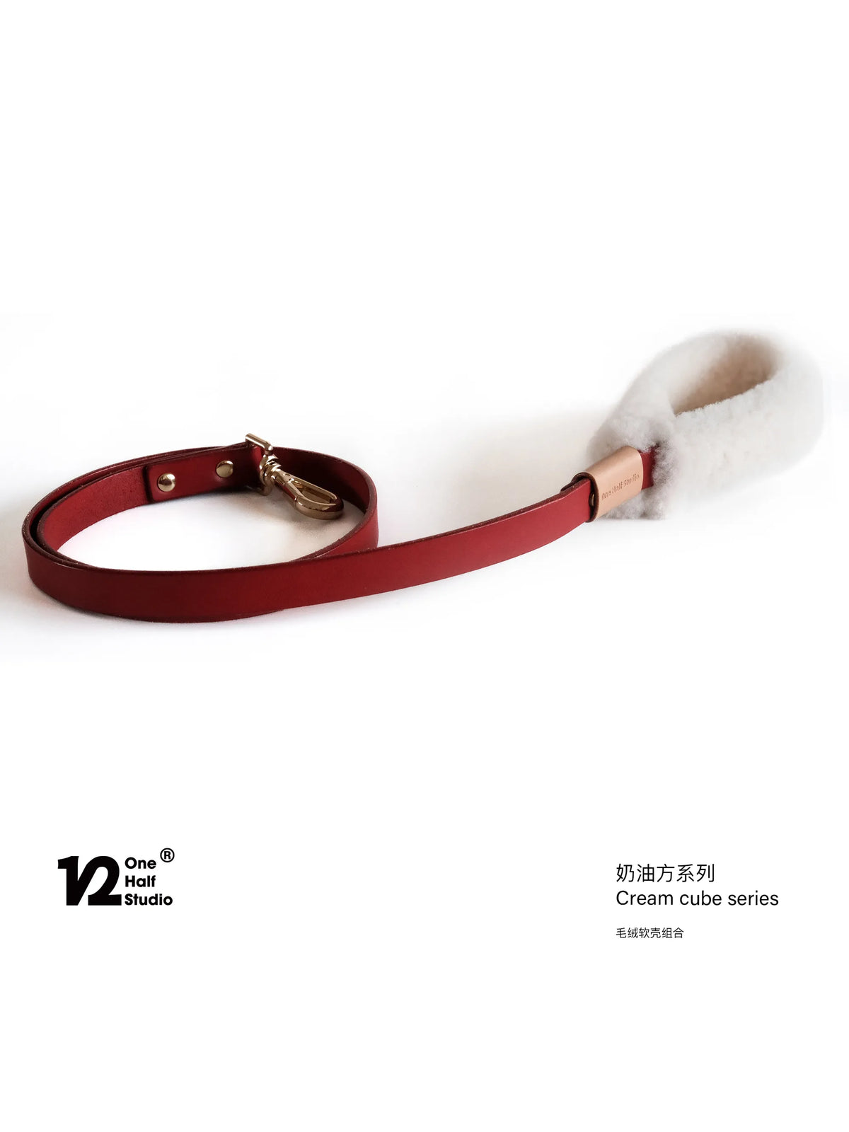Red collar and leather leash set laid flat